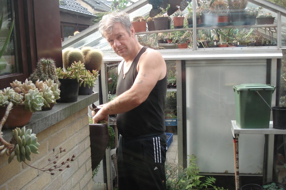 Photo:  Mario Couvreur, Belgium, working in his greenhouse